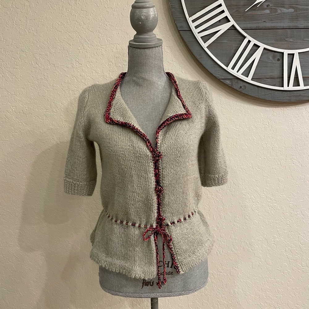 Beautiful wool knit vest. Very stylish. To wear on top of a long sleeves.